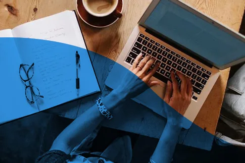a person typing on a laptop